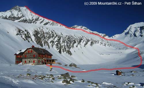 Arthur von Schmidt Haus – 2272 m. At the background in the left upper part Säuleck is seen, right from the hut is frozen Dosener See