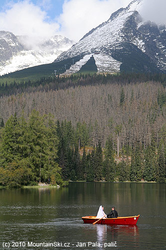 Just married at Štrbské pleso, ski routes from Chata pod Soliskom in the background