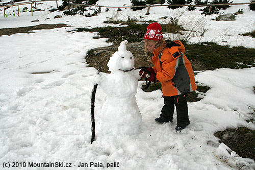 Snowman in front of hut Chata pod Soliskom is finished