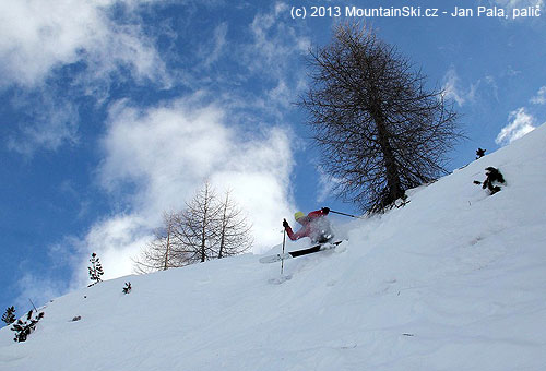 Čeněk is skiing down