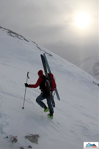 We reached the ridge on feet with skis attached to backpacks