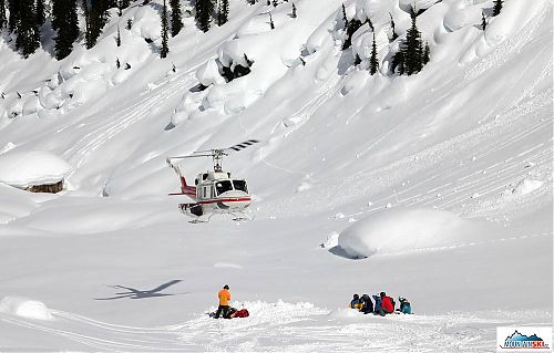 Helicopter is landing to take up other group...