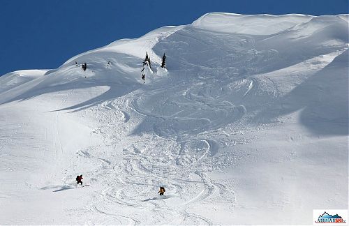 Colleagues from France during excellent skiing starting just below cornice